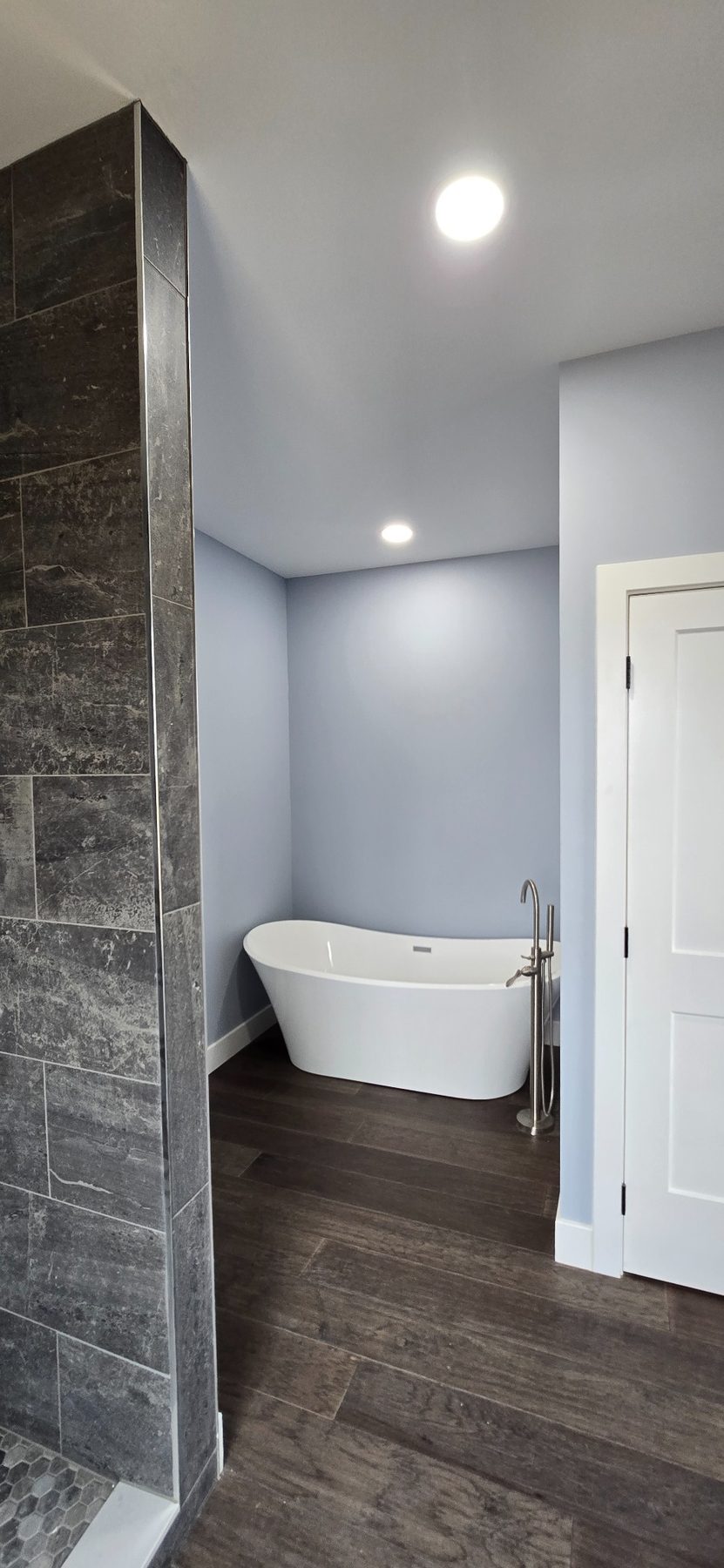 Bathroom with shower and freestanding tub