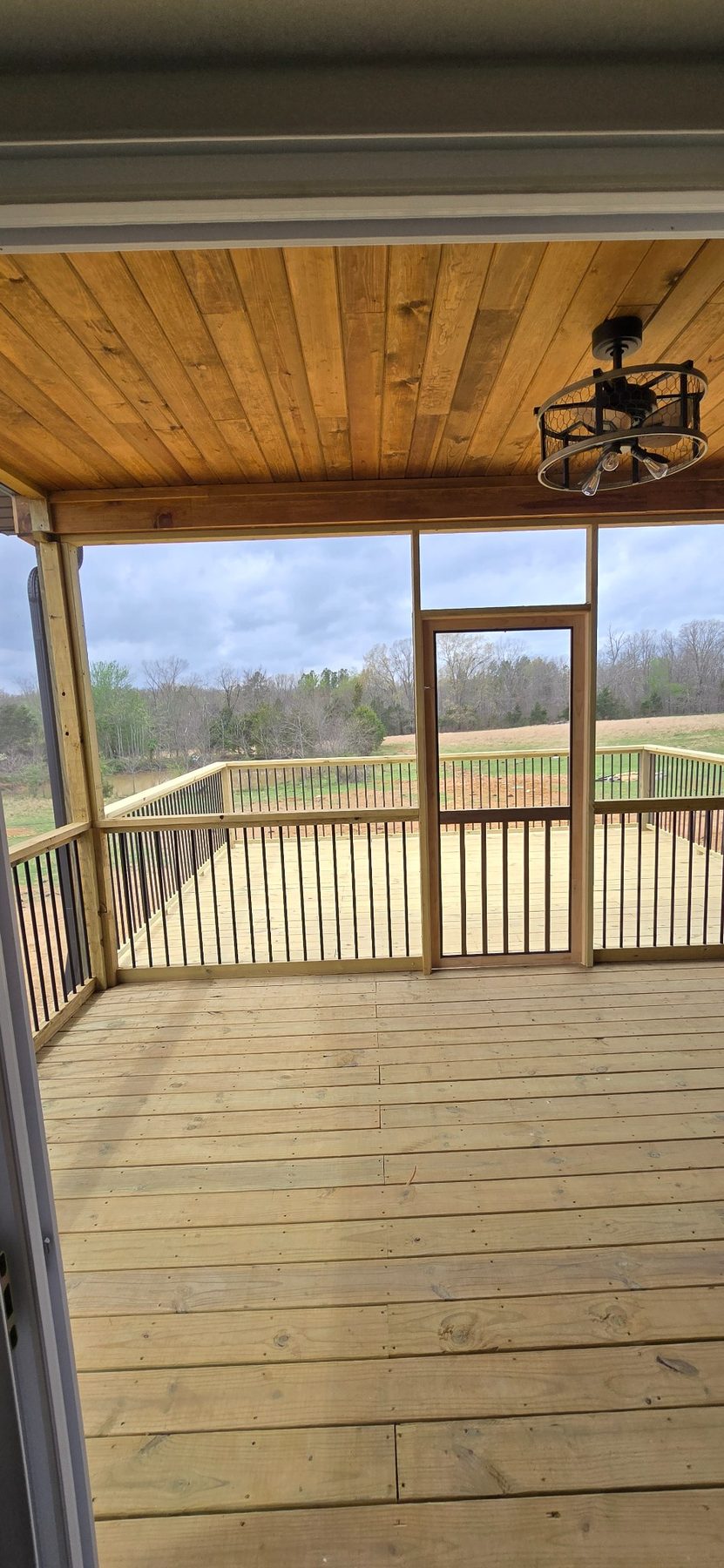 Covered porch with wood ceiling