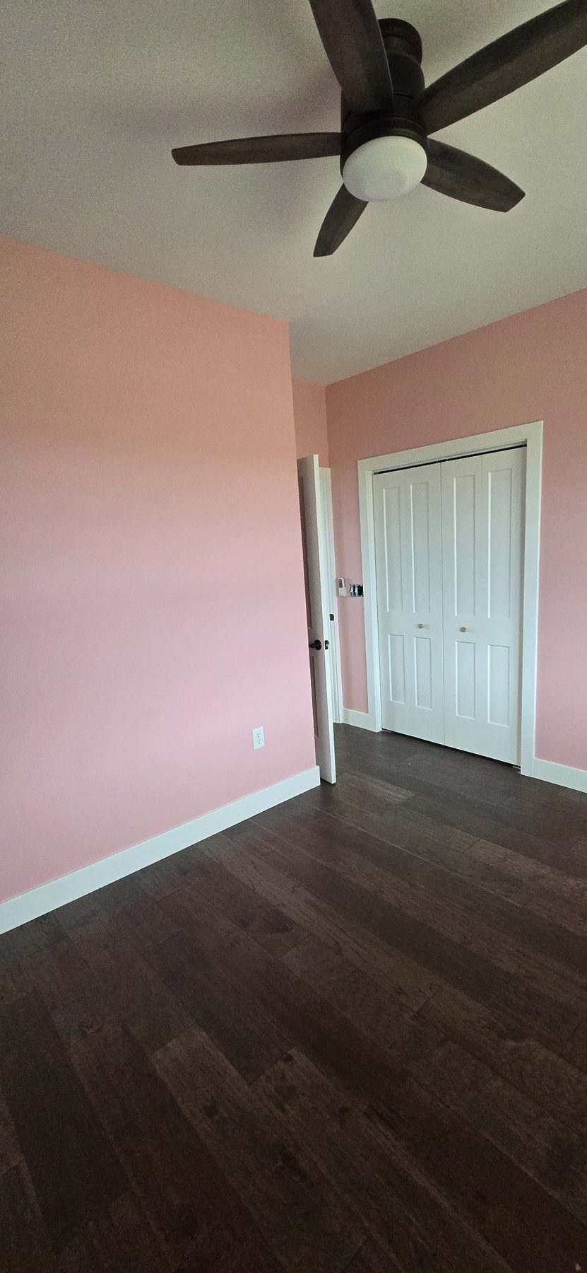 Pink bedroom with ceiling fan