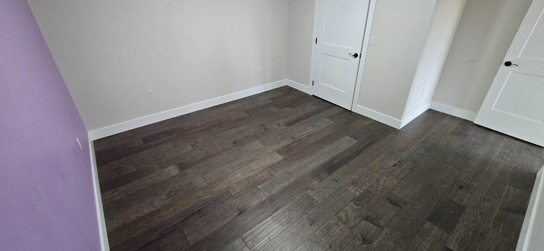 Bedroom with wood-look flooring