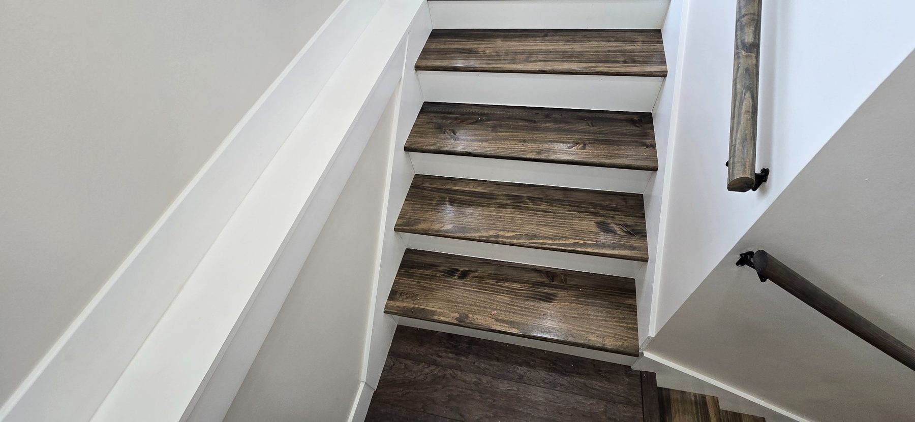 Wood-look stair treads and white railing