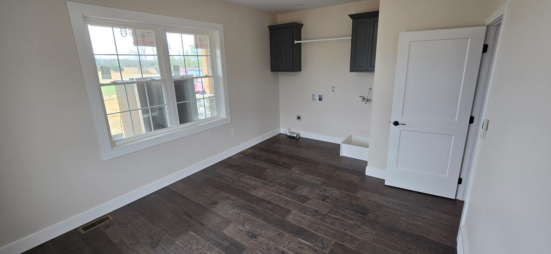 Bright room with windows and built-in shelves