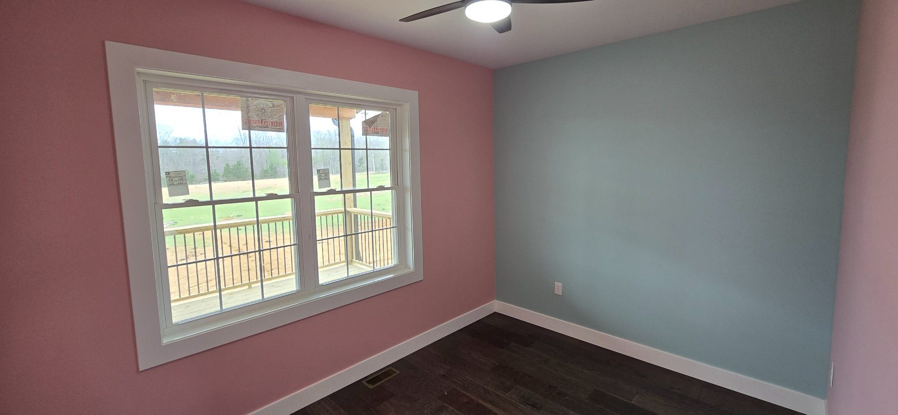 Colorful bedroom with two windows