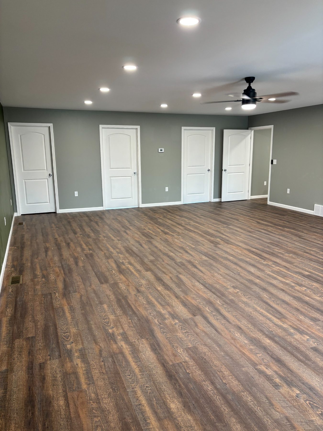 Open living area with wood-look floors