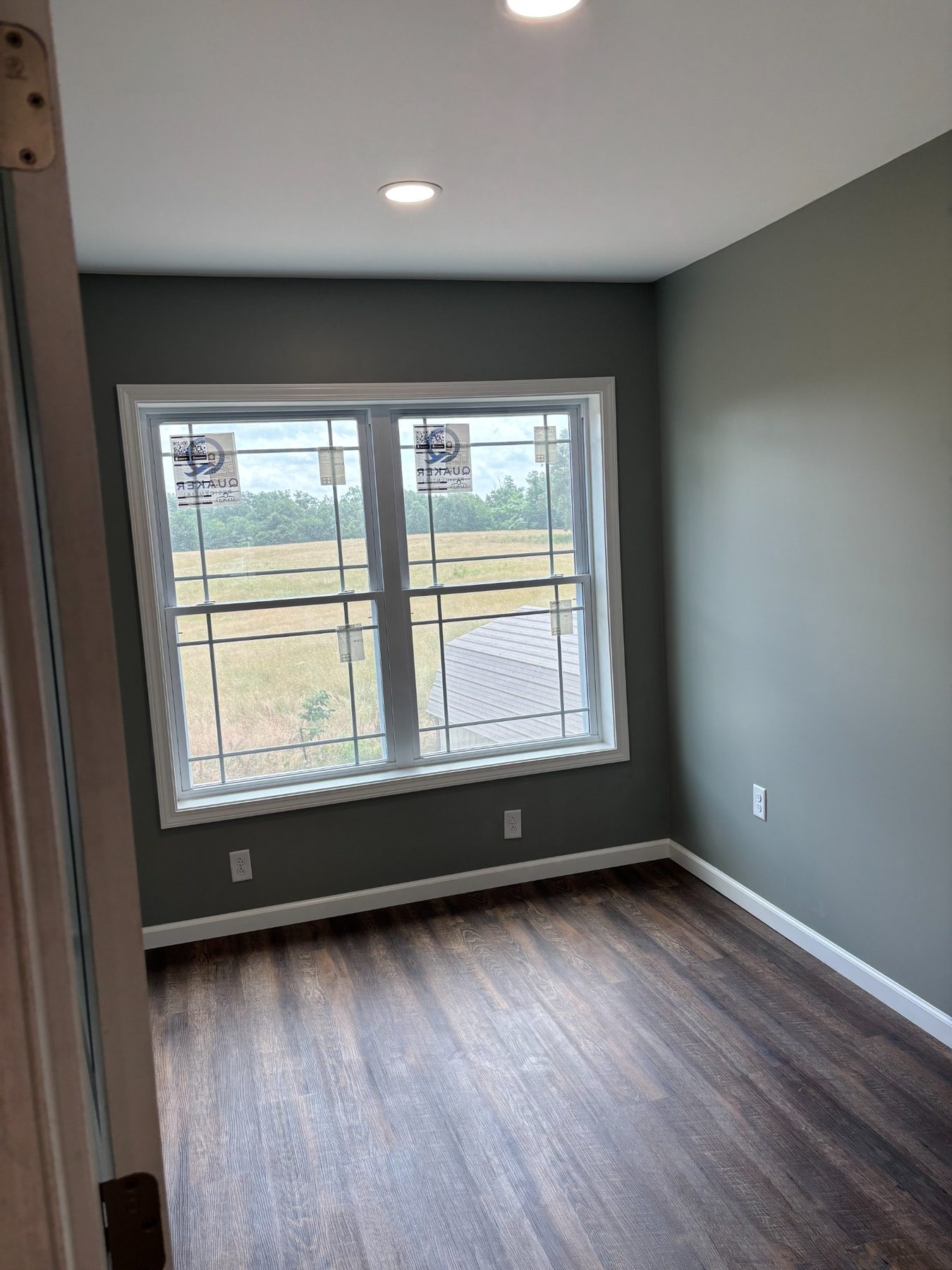 Room with window and dark accent wall
