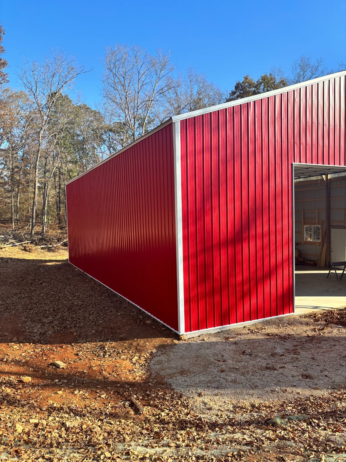 Red metal siding and large opening
